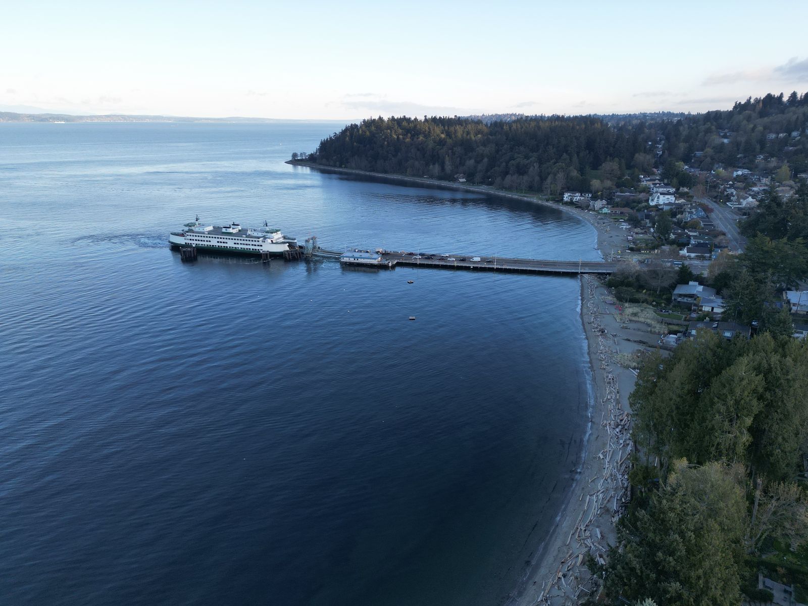 Aerial photograph of a Washington State ferry at the Fauntleroy dock on a calm morning